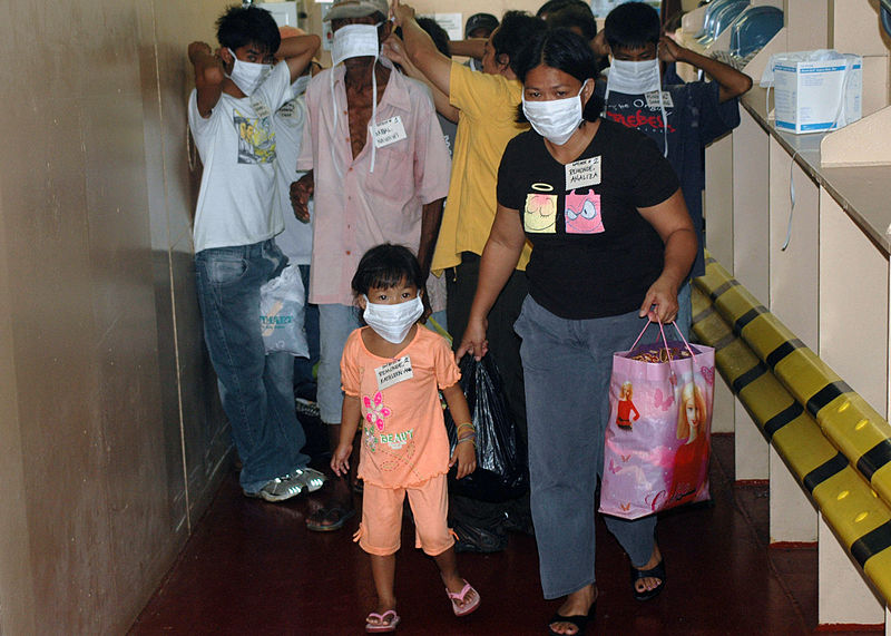 US_Navy_060614-N-9076B-162_Patients_don_mask_and_began_their_walk_up_a_ramp_to_medical_treatment_facilities_the_U.S._Military_Sealift_Command_(MSC)_Hospital_Ship_USNS_Mercy_(T-AH_19)
